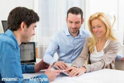 Real Estate Agent with Buyers - Couple